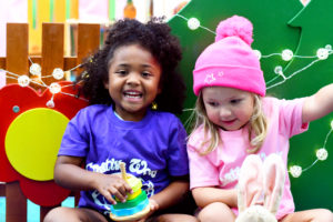 Winter fun girls smiling preschool