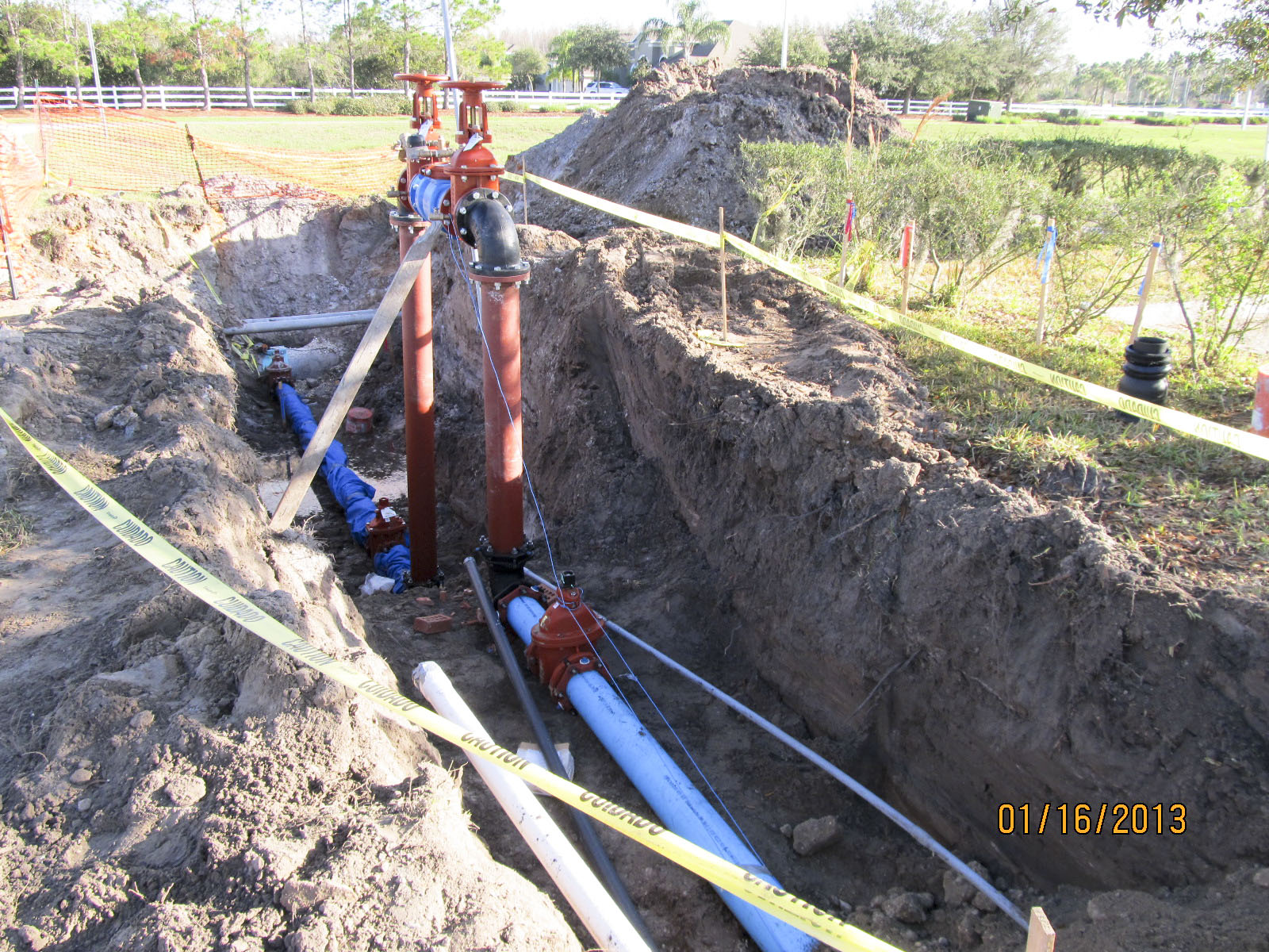 Utility pipes are laid in the ditches.