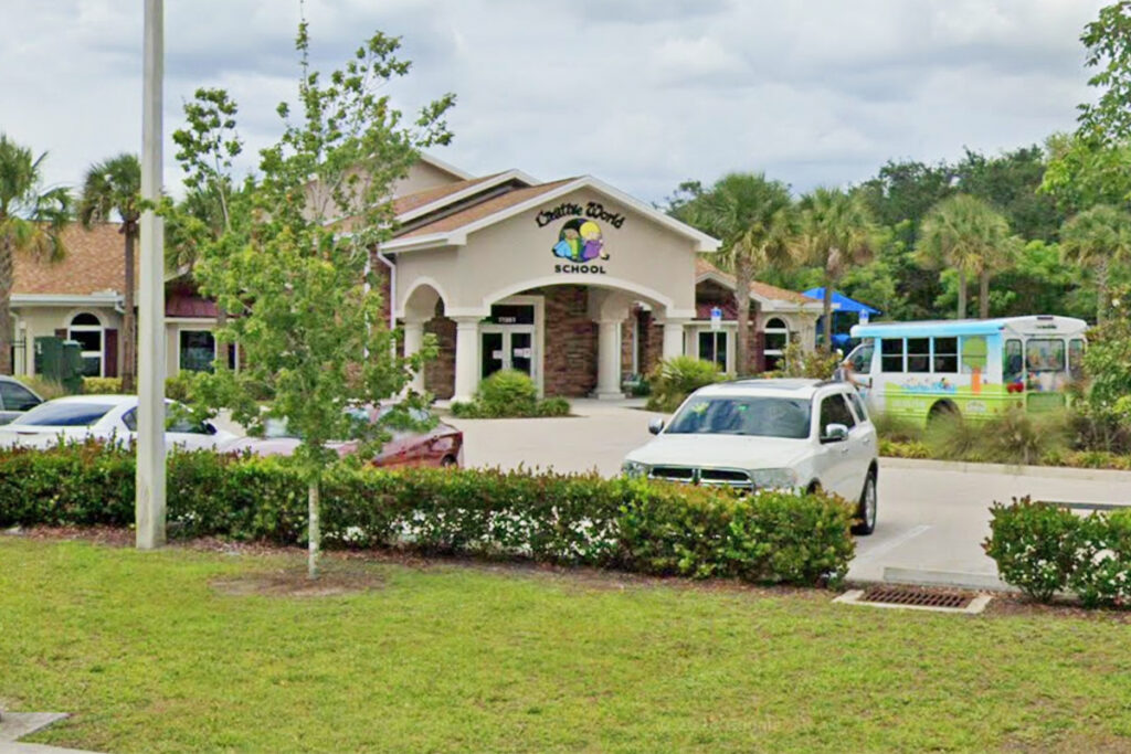 Exterior view of Creative World School at Gateway, highlighting the school entrance surrounded by greenery.