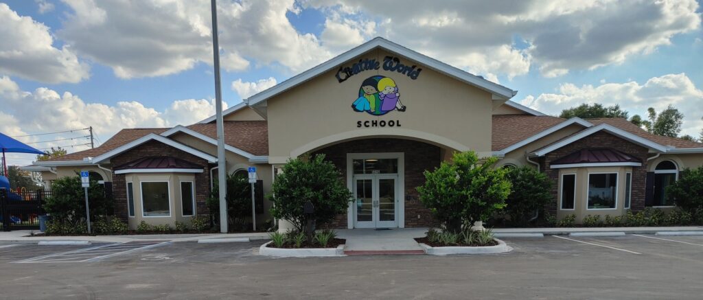 Front view of Creative World School at UCF Orlando, showcasing the building entrance and surrounding landscaping.
