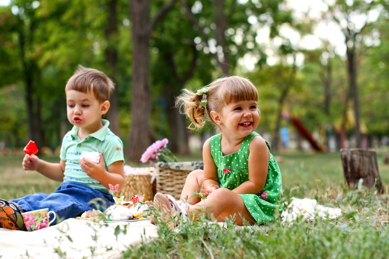 Family having a picnic outdoors in Oakstead