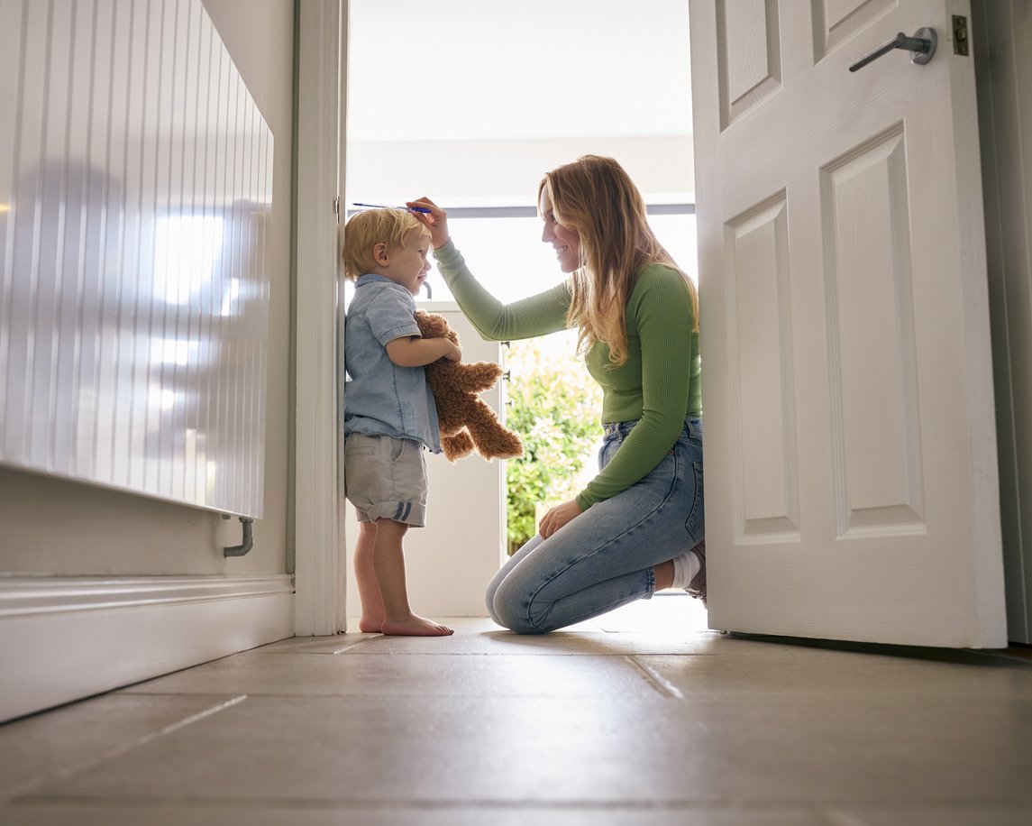 Toddler HeightMeasure Parent Hallway