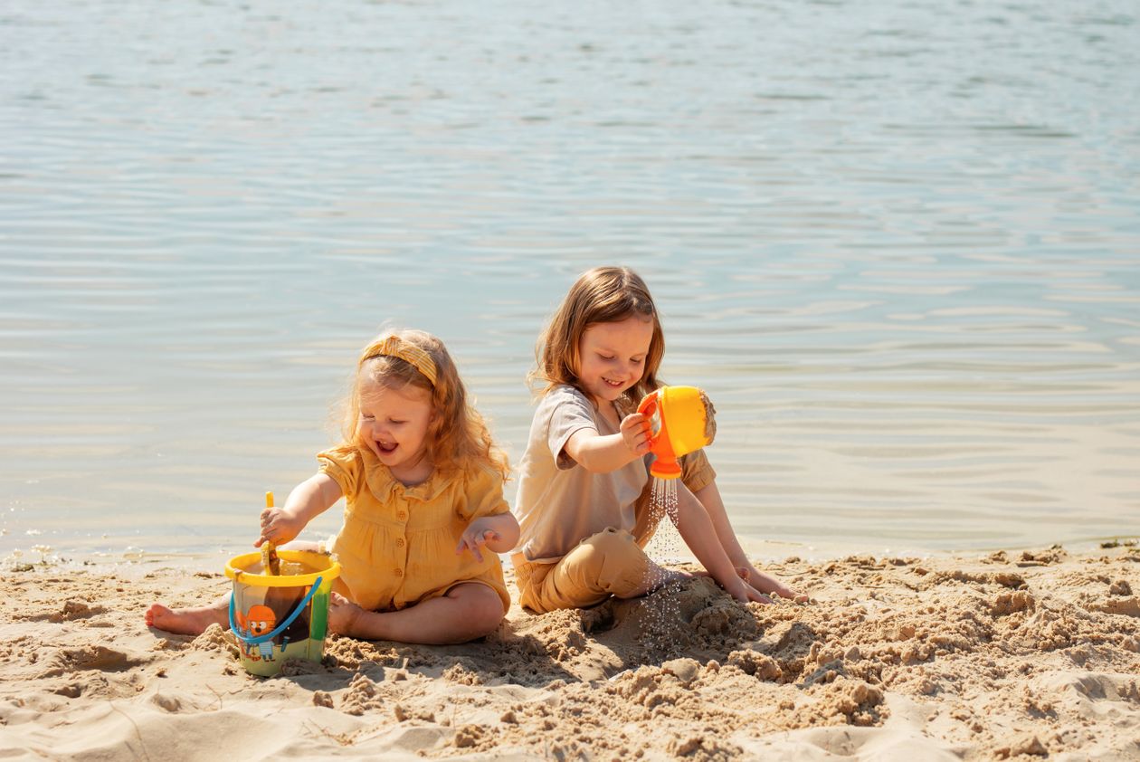 Two girls playing on a beach