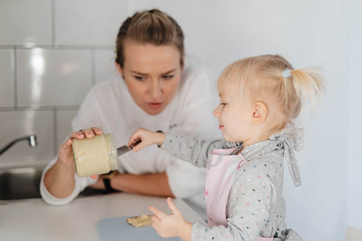 Mother with daughter in kitchen