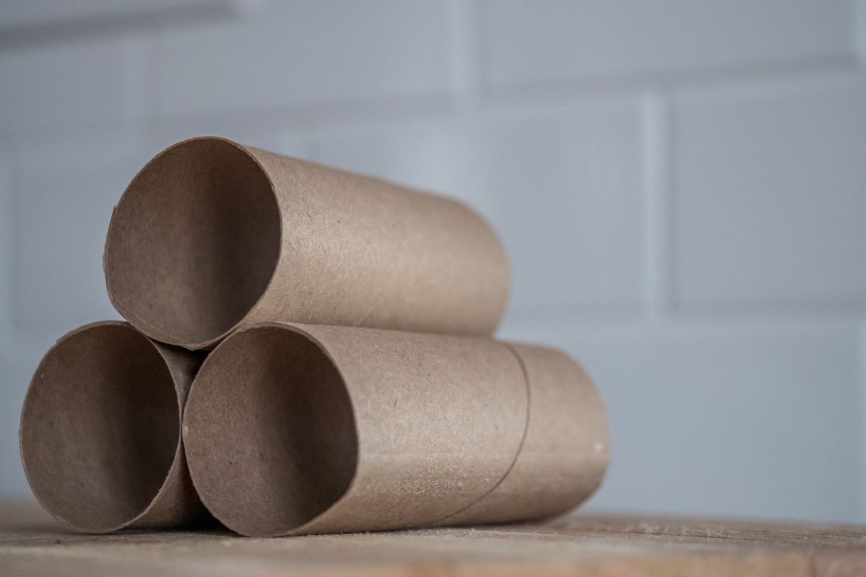 Stack of carton rolls on table